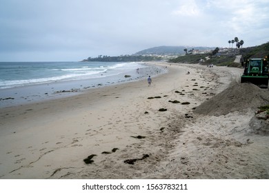 Dana Point, California, US - August 6, 2019
Tractor Doing Beach Cleanup After Storm 