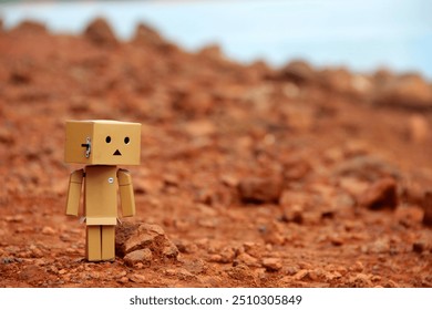 Danbo Paper Dolls are standing on the land of a drying lake in Riam Kanan Village, South Borneo. - Powered by Shutterstock