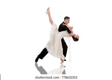 dance ballroom couple in a dance pose isolated on white background. sensual professional dancers dancing walz, tango, slowfox and quickstep.