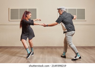 Dance Couple Doing A Lindy Hop Dance Move