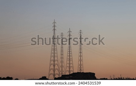 Dance of electric poles -  High voltage power lines with amazing sunset