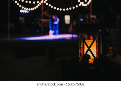 A Dance Floor In The Background At A Wedding.