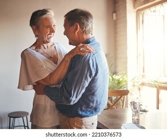 Dance, Freedom And Retirement With Senior Couple Dancing In Celebration, Having Fun And Bonding In Living Room. Fun, Romance And Active Seniors Sharing A Funny Joke And Enjoying Retired Lifestyle