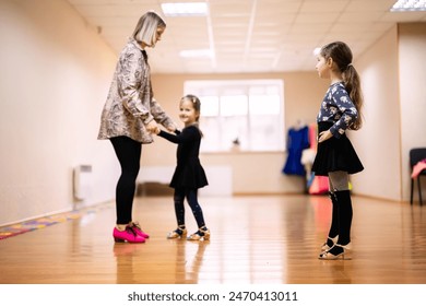Dance Instructor Teaching Two Young Girls in Dance Studio