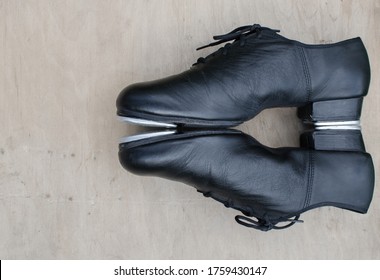 Dance men's shoes.
Traditional step shoes on a wooden background and stand on the floor. - Powered by Shutterstock