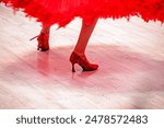 dance on high heels dance in a lush black red dress, standard. Ballroom sports dancing
