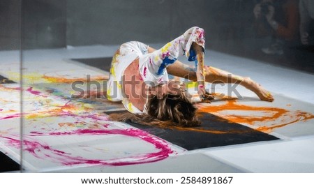 Dance, Painting, and Creative Expression – A Young Beautiful Woman Posing in a Photo Studio"