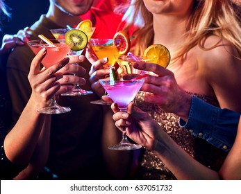 Dance Party With Group People Dancing. Women And Men Have Fun And Drinking Martini Cocktail With Fruit In Night Club. Happy Man In Hat On Foreground. Meeting Of Graduates At Disco.