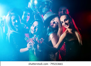 Dance Party With Group People Dancing. How To Be An Alpha Male At A Club. Women And Confident Casual Smiling Man Have Fun In Night Club. Seduce Boozy Woman Cuddles Up Guy. Rest After Hard Day At Work.