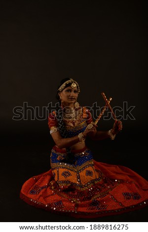 Dance poses of western India folk dance Garba performed during festival Navaratri Dussehra to celebrate the festival
