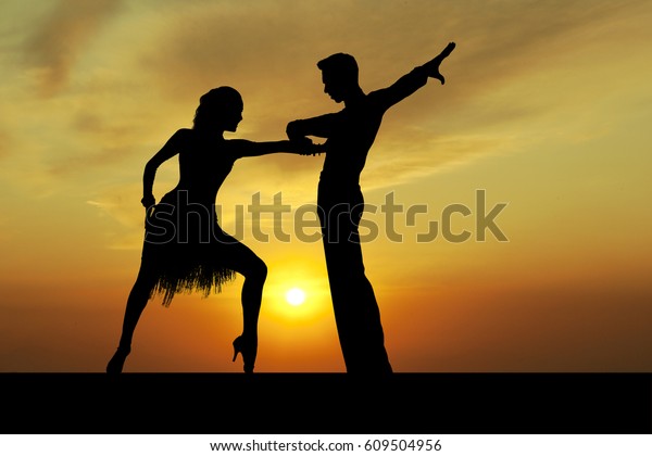 Dance silhouette couple dancing ballroom\
dancing on sunset \
background