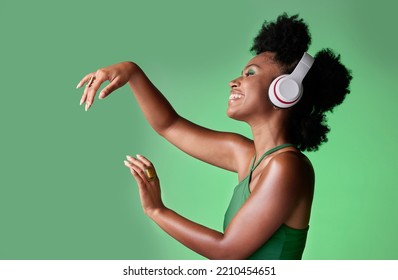 Dance, Studio And Black Woman Dancing To Music In Headphones While Streaming Happy Audio Sounds From A Playlist. Freedom, Smile And Young African Girl Enjoying Listening To Radio With Mockup Space