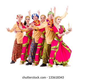 dance team dressed in Indian costumes posing.  Isolated on white background in full length.