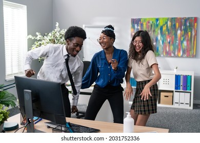 Dance At Work, Office, Break From Duties, Company Party, Two Girls And A Man In A Shirt And Tie Dancing Together, Fooling Around, Laughing, Smiling, Relieving Stress, Music Playing From The Computer