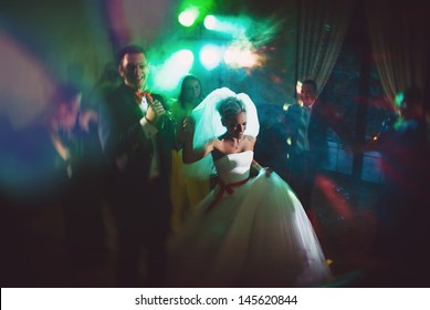 dance young bride and groom in dark hall