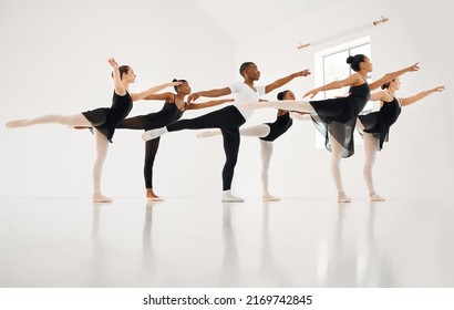 Dance, If Youve Torn The Bandage Off. Shot Of A Group Of Ballet Dancers Practicing A Routine In A Dance Studio.