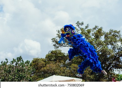 Dancer against blue sky during a dragon dance performance during Chinese new Year season China