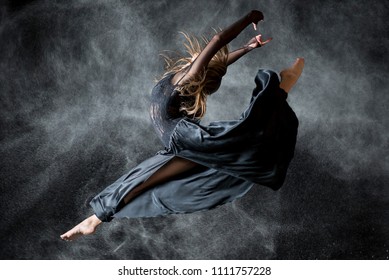 Dancer In The Black Background