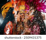 Dancer, celebration and carnival for art, event or street festival as parade or entertainment in Brazil. Female people, fashion and laugh for freedom, energy or culture as tradition in Rio de janeiro