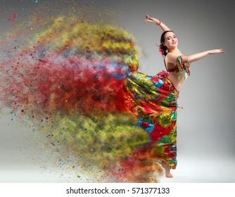 Dancer with disintegrating dress. Abstract vision. Photo manipulation