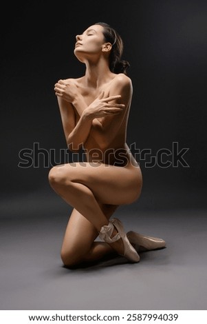 Dancer gracefully poses in a dramatic ballet expression