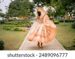 Dancer is gracefully spinning while performing the traditional peruvian marinera in a serene park setting