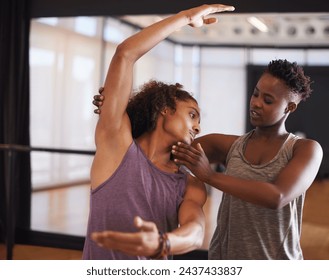 Dancer, instructor and balance for learning, exercise and fitness in a dance studio with form help. Support, teacher and performance workout of man with ballet and wellness in a performing arts class