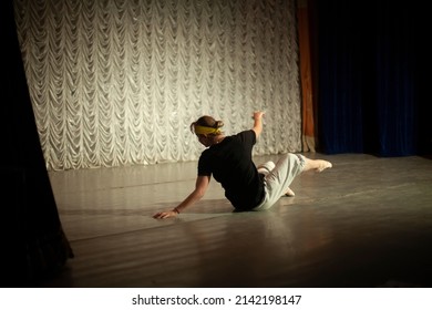 Dancer Lies On Stage. Ballerina Shows Movement. Dance Lesson. Girl Expresses Pain. Choreography Lesson.