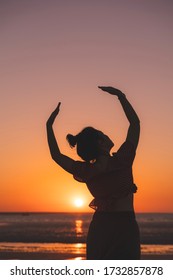 Dancer On The Beach In The Golden Sunlight. Mindil Beach, Darwin, NT, Australia.