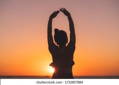 Dancer On The Beach In The Golden Sunlight. Mindil Beach, Darwin, NT, Australia.