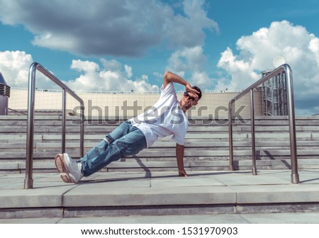 Similar – Athletic man warming up before running.