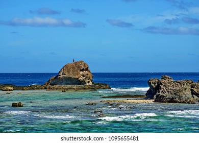 Dancer On Top Of A Rock At The End Of An Island In Fiji