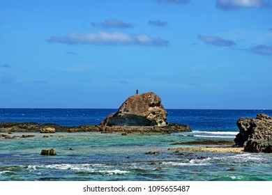 Dancer On Top Of A Rock At The End Of An Island In Fiji