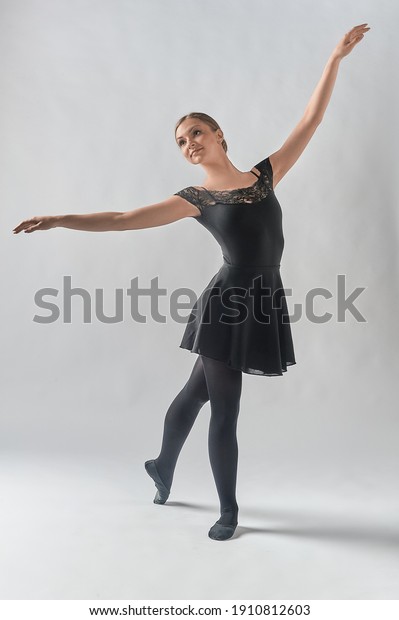 a dancer, on a white background. A\
dancing woman. The ballerina stands at full\
height.