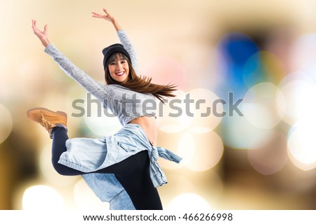 Dancer posing on unfocused background