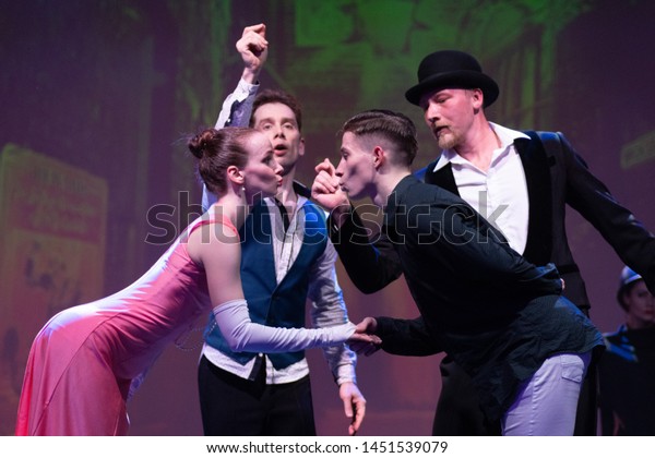 Dancers actors perform in the theater on stage in a\
dance show