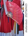 Dancers dancing and wearing one of the traditional folk costume from South Korea