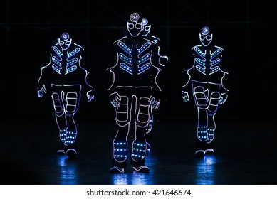 Dancers Led Suits On Dark Background Stock Photo (Edit Now) 421119997