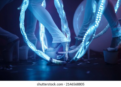 dancers in neon costumes. dancers feet close-up neon