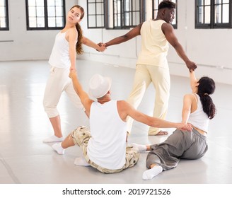 Dancers On Stage, Modern Choreography With Elements Of Theatrical Production