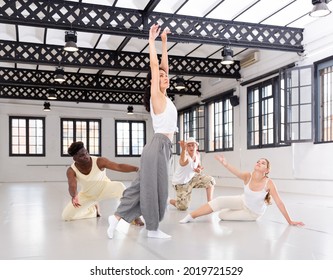 Dancers On Stage, Modern Choreography With Elements Of Theatrical Production