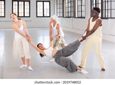 Dancers On Stage, Modern Choreography With Elements Of Theatrical Production