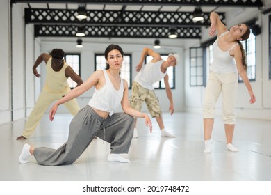 Dancers On Stage, Modern Choreography With Elements Of Theatrical Production