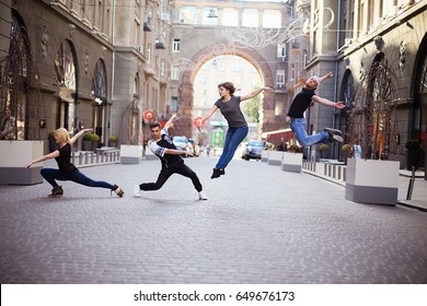 Dancers On The Street, Two Boys And  Two Girls Jumping And Dancing On City Streets 