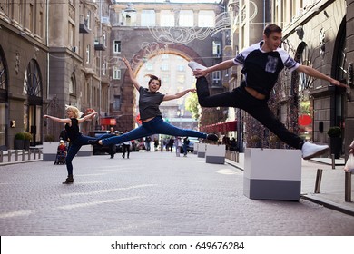 Dancers On The Street, Two Girls And Boy Jumping And Dancing On City Streets 