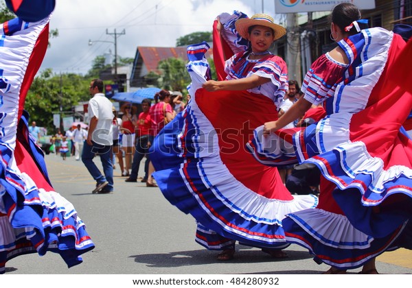 Dancers\
in traditional Costa Rican clothing the color of the nation\'s flag\
wow onlookers with traditional dances during the Independence Day\
parade in Quepos, Costa Rica, September 15,\
2016