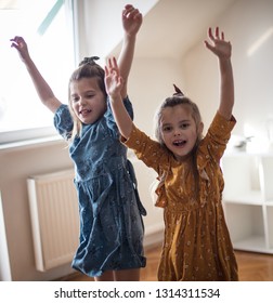 Dancing and be happy. Two little girls playing at home. - Shutterstock ID 1314311534