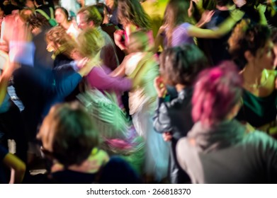 Dancing Crowd At Night, Abstract Motion Blur Photo.