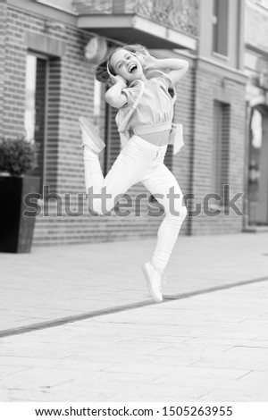 Similar – Image, Stock Photo Happy woman jumping in front of stone wall background