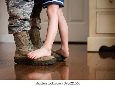 Dancing with daddy before deployment - Shutterstock ID 378621568